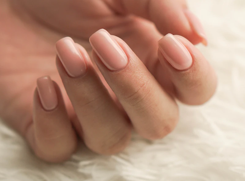 Nude manicure with glossy finish